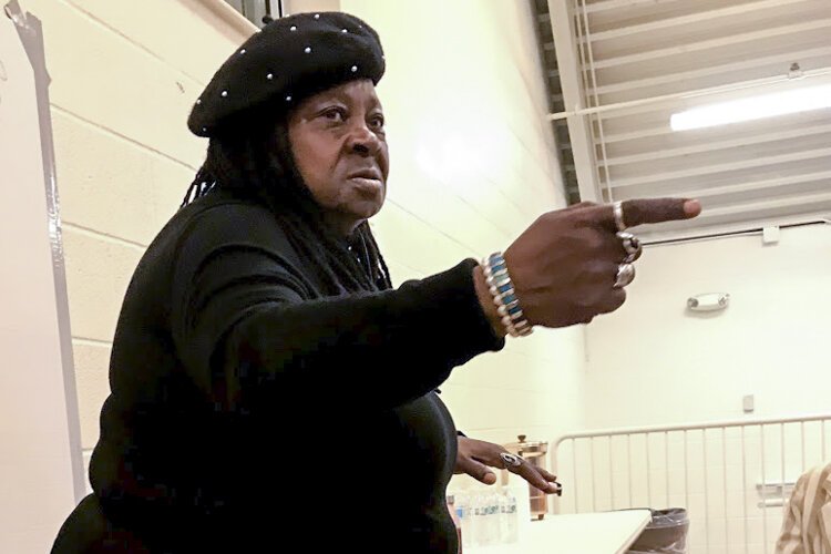 Gwendolyn Garth, founder of Kings & Queens of Art, speaks during a reverse ride-along stop in Central in November.