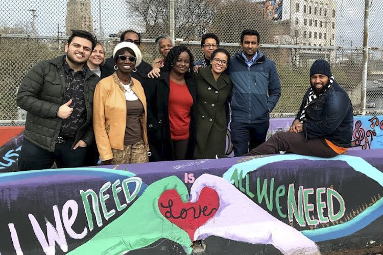 Participants in a reverse ride-along pose on a bridge over the Inner Belt in November.