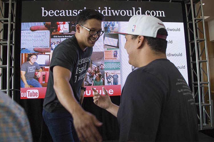 <span class="content-image-text">Alex Sheen shaking hands at a high school chapter meetup</span>