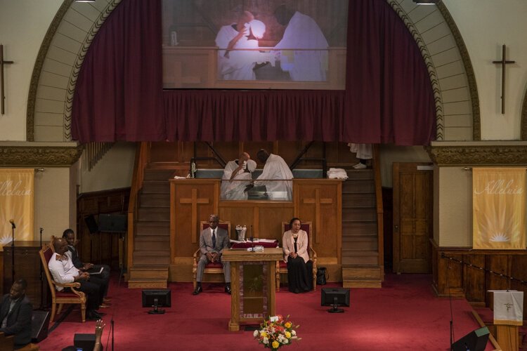 A parishioner being baptized at Antioch Baptist Church