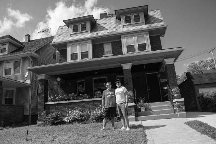 Todd Barr and Dane Vanatter in front of their home in Glenville