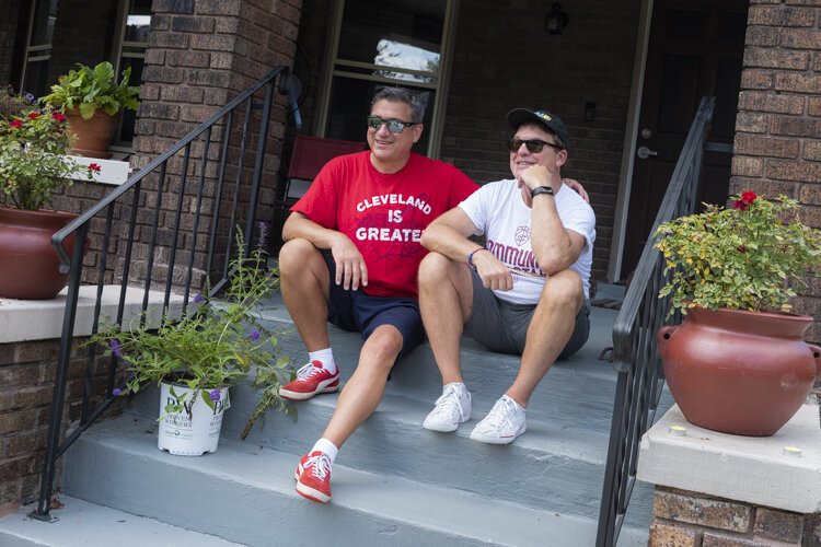 <span class="content-image-text">Todd Barr and Dane Vanatter on the front steps of their home in Glenville</span>