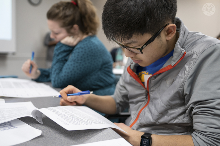 <span class="content-image-text">Timothy Huang, a senior from Solon High School, reads through a request for funding from several agencies in the Greater Cleveland area</span>