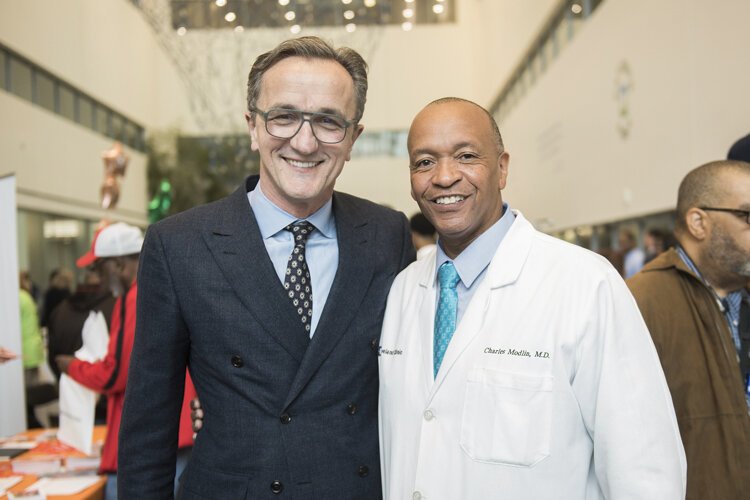 Dr. Tomislav Mihaljevic, president and CEO of the Cleveland Clinic, with Dr. Charles Modlin at the Minority Men's Health Fair in 2018.