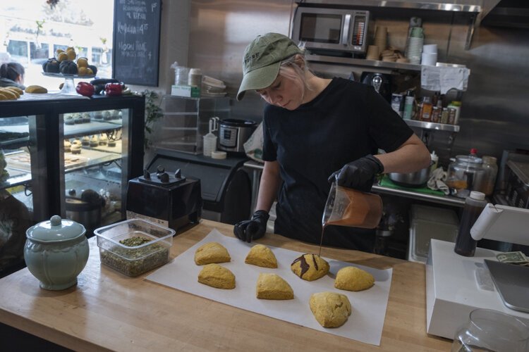 <span class="content-image-text">Nikole tops the pumpkin scones with chocolate ganache drizzle.</span>