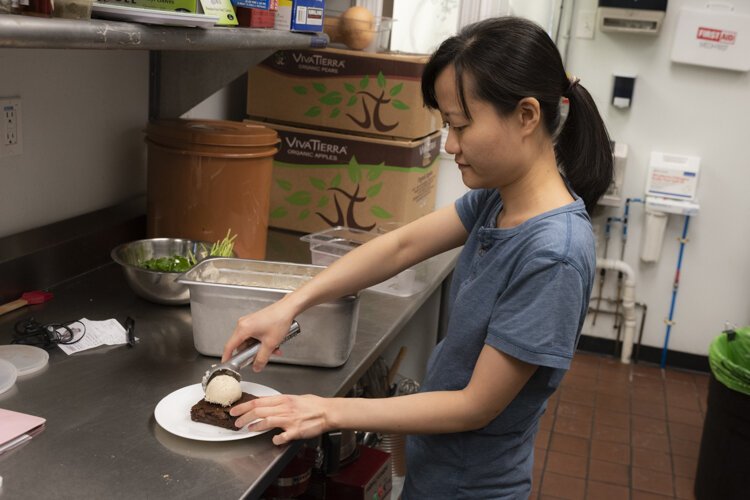 <span class="content-image-text">Frances Cheng whipping up a sweet dessert at Foodhisattva.</span>