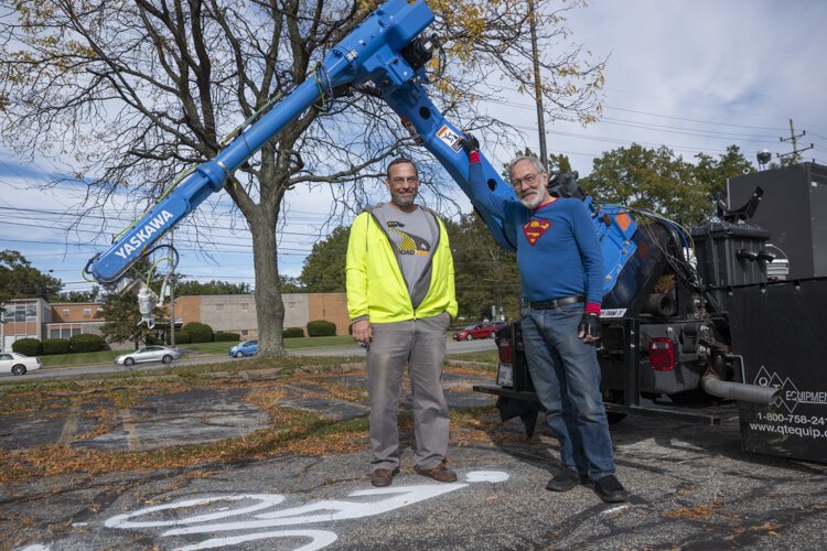 Sam Bell (right) and business partner Wyatt Newman have formed a strategic partnership with QT Equipment Co. of Akron to build a customized truck.