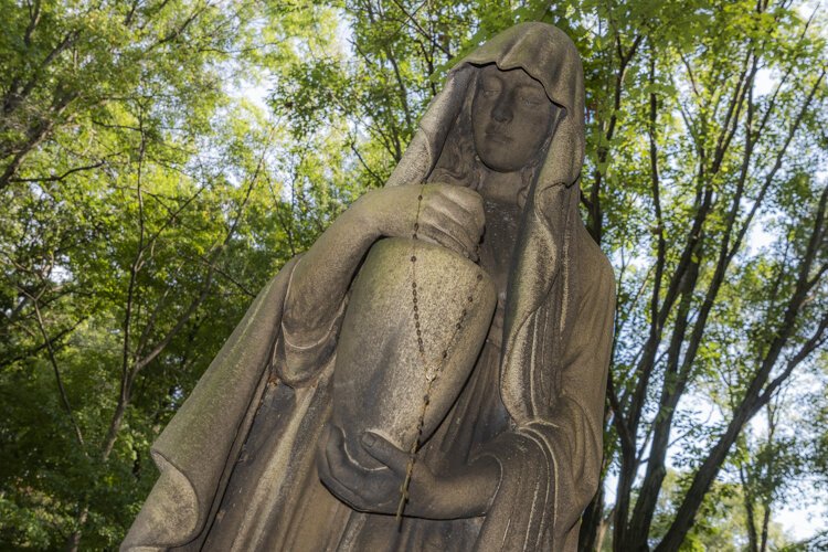 The Peck family memorial in Section 12 mesmerizes Lake View President and CEO Katharine Goss. "They are just so sad and eerie looking," she says.
