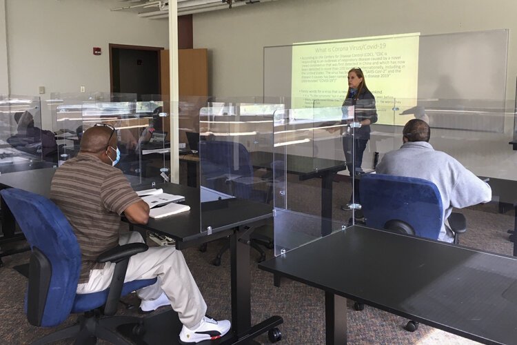 MAGNET constructed a specially designed classroom with plexiglass dividers, temperature checks, and strict sanitation practices for their manufacturing training program classes.