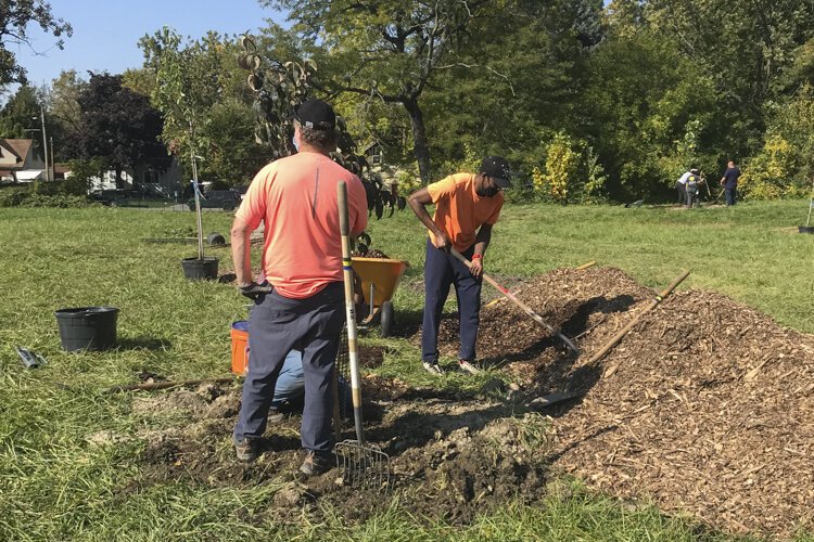 The design for the Garden of 11 Angels calls for planting native trees and flowers, a memorial plaque, and open green space for the community to enjoy.