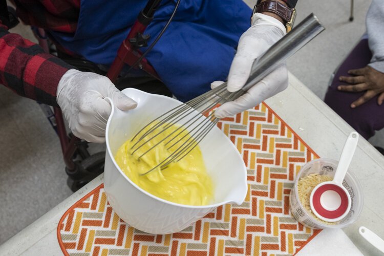 Whipping up some eggs for a healthy quiche recipe.
