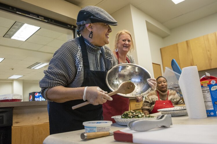 The seniors enjoy their twice-a-month cooking sessions with Susan Porter.