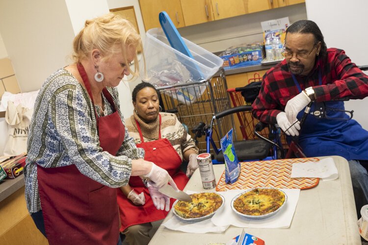Susan Porter serves up some delicious healthy quiche after a Recipe Re-mix project session at Cedar High Rise.