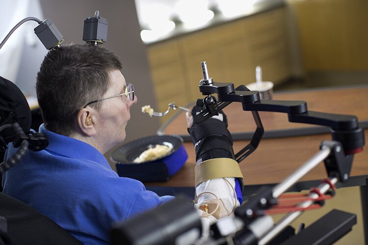 Bill Kochevar, a Cleveland veteran, participated in an FES Center study in 2014 that used brain implants and sensors to give him use of his right hand and arm.