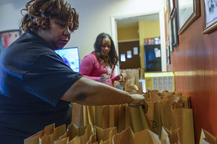 Babies and Brunch volunteers meet each morning and pack bags with breakfast, lunch, and hand sanitizer, and deliver the meals to designated households.