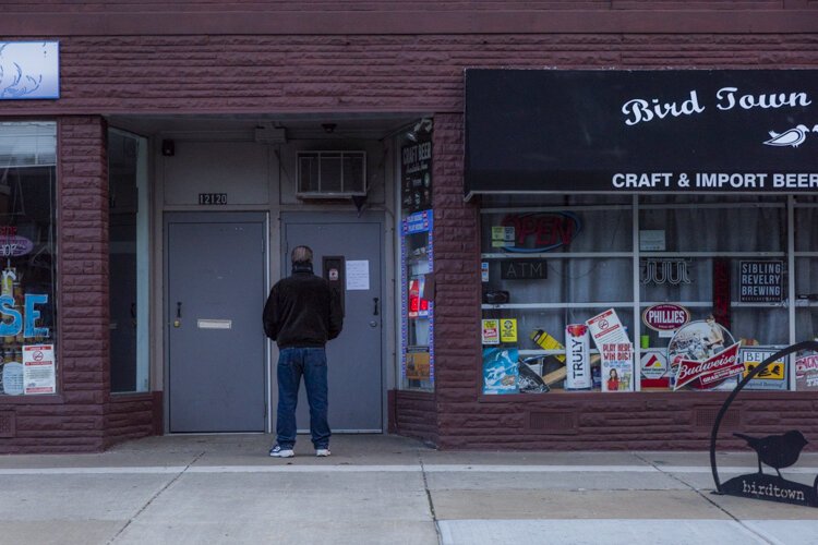 The sign reads: "Please do not visit if you are feeling sick and contagious. Be Kind. Stay Home."