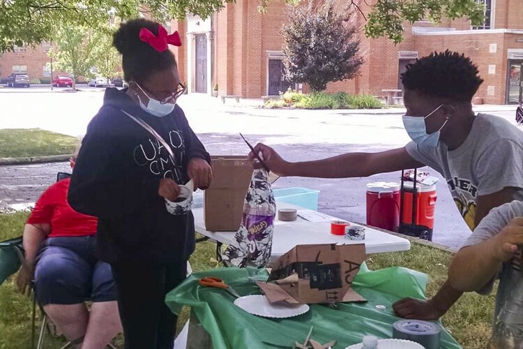 <span class="content-image-text">Teenagers in the Youth Opportunities Unlimited employment program doing beautification projects in the neighborhood.</span>