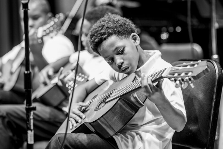 Archie Green created a four-month performance art project called My Violin Weighs a Ton, working with Lexington-Bell Community Center in the Hough neighborhood and with the Cleveland Orchestra and the Cleveland Classical Guitar Society.