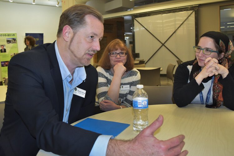 Michael Sering, vice president housing & shelter, Lutheran Metropolitan Ministry, with staff partners describing new initiatives.