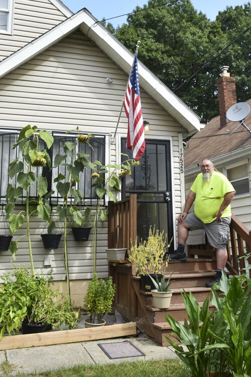 <span class="content-image-text">Bill Shelbrick, 42, is a more recent transplant to Lee-Harvard says he thinks the neighborhood’s community spirit is still going strong, noting that during and after he planted his garden in his front yard, many neighbors came by to talk to him.</span>