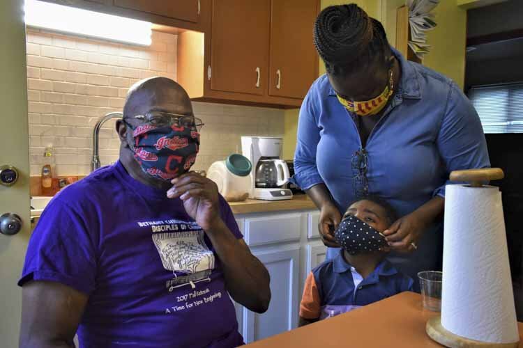 Miles Hackney, 79, has lived in his home in the Lee-Harvard neighborhood for 50-plus years, where he raised his four children. He’s seen here with his great grandson, Dom, and his granddaughter, Leah (right).