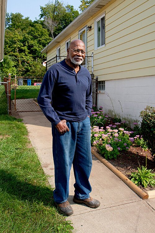 <span class="content-image-text">Miles Hackey outside of his home on East 177th Street in the Lee-Harvard neighborhood</span>