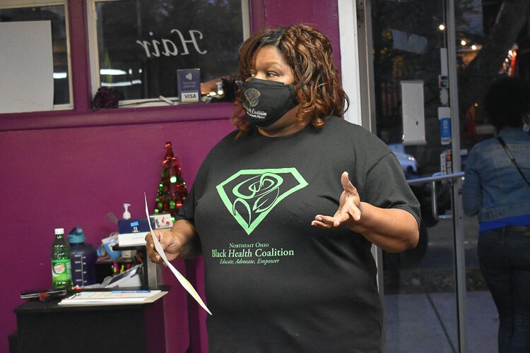 <span class="content-image-text">Yvonka Hall, executive director of the Northeast Ohio Black Health Coalition, helps people understand the intricacies of the Child Tax Credit during an event at A Touch of Rain Nail Spa in November.</span>