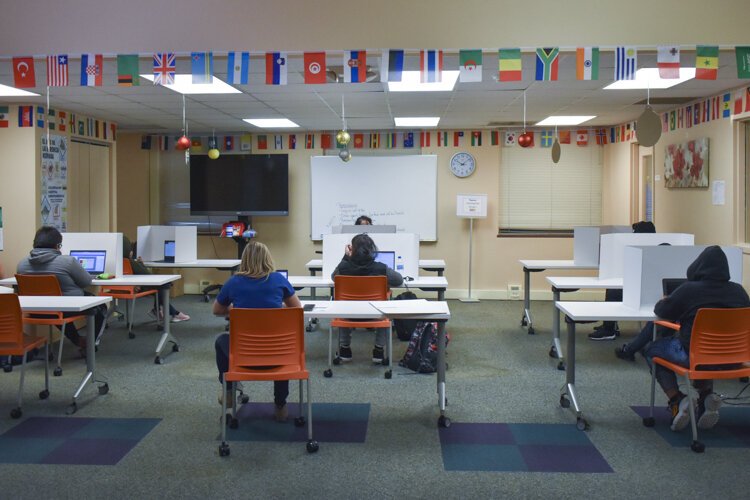 A small group of Hispanic CMSD students attend their virtual-only classes inside the Cleveland nonprofit Esperanza, Inc’s offices.