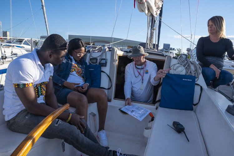 Charlotte and Emmanuel get a pre-sail crash course on sailing from Captain Scott.