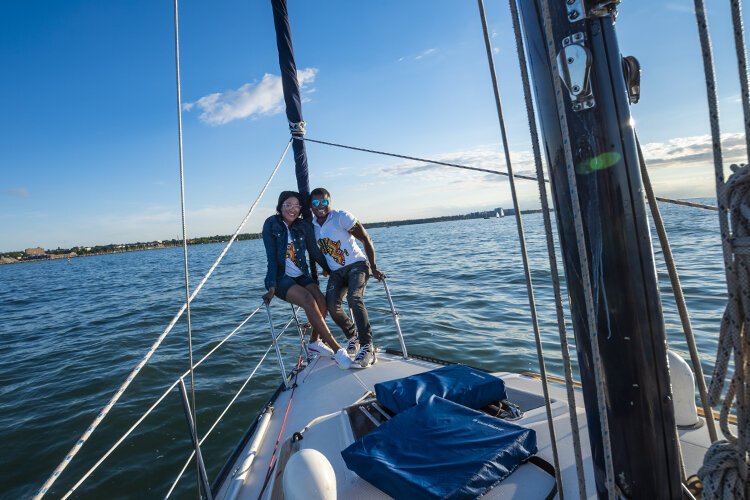 Charlotte Atasige and Emmanuel Ketekewu celebrate their 3-year wedding anniversary with a cruise on the Wabi Sabi by Cleveland Sailing Charters.