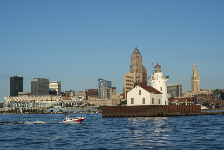 The Cleveland Harbor West Pierhead Lighthouse against the Cleveland skyline.