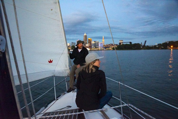 Enjoying the calm lake and city lights at sunset.