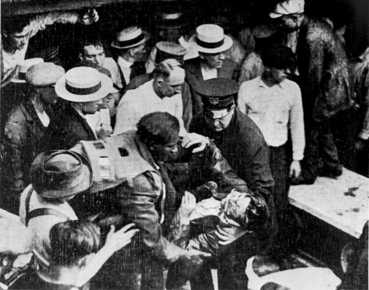 <span class="content-image-text">Garrett Morgan rescues a victim of the Waterworks Tunnel Disaster, July 1916.</span>