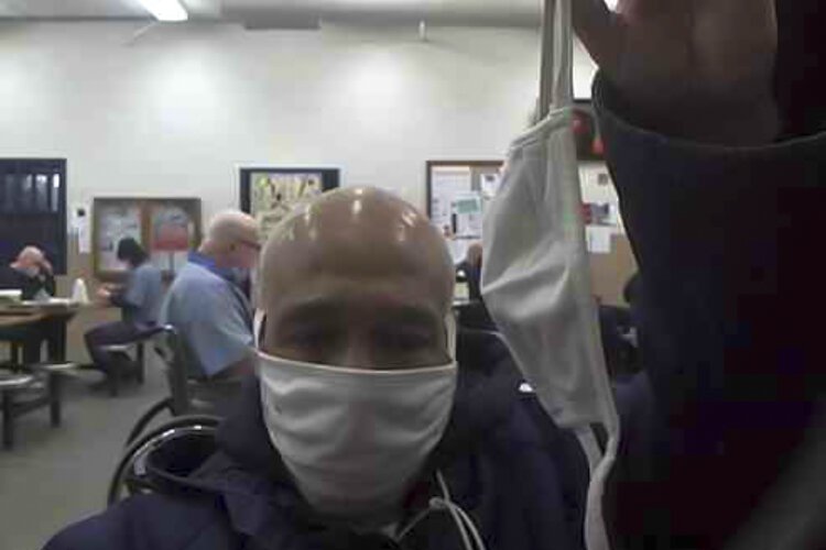 <span class="content-image-text">66-year-old prisoner Billy Renshaw, with the two styles of masks being distributed to Pickaway prisoners.</span>