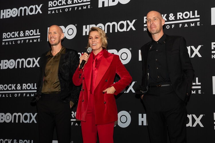 Brandi Carlile, flanked by identical twins Phil and Tim Hanseroth