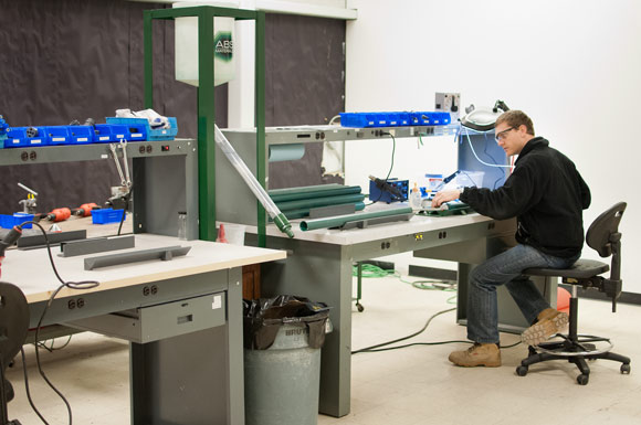 Project Engineer Patricio Ortiz constructs a VOCSock®, a self-contained water processing device inserted into a monitoring well to remediate water
