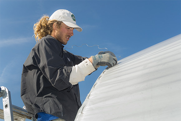 Todd Alexander of Tunnel Vision Hoops working on a hoop house in Ohio City
