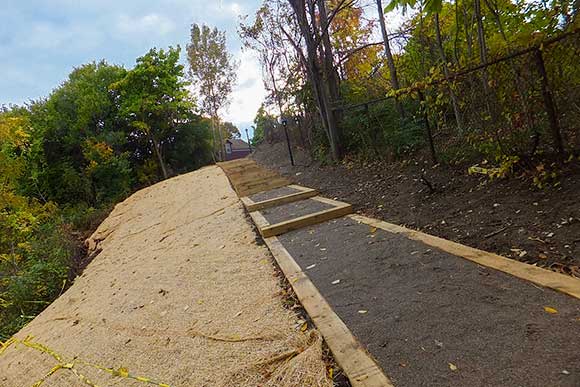 West 12th Street path links the neighborhood with footbridge over 490