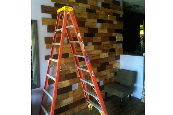 Interior wall of Cafe Avalaun covered with reclaimed pallet wood