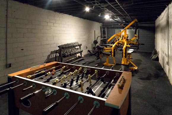 Foosball and free weights in the basement at EDWINS Campus