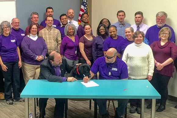 Elyria native Corp. Leo Robinson signed the final closing documents for his new house in South Euclid during a Feb. 18 ceremony at Cuyahoga Land Bank