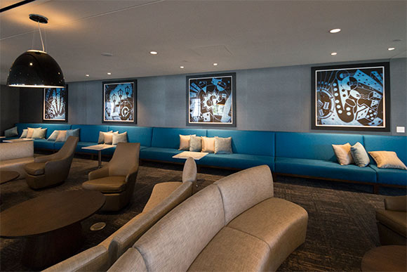 The lounge area of Eliot’s Bar with prints by local artist Paul Duda