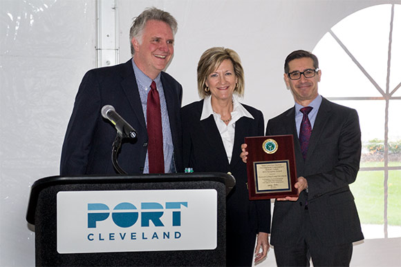 The Honorable Betty Sutton presents the Port with the 2015 Pacesetter Award. Left is Chris Ronayne, Port Chair and right is Will Friedman, Port President and CEO