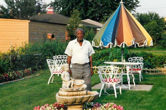 The Late Mr. Connie Walker in his lovely backyard on Myrtle Avenue