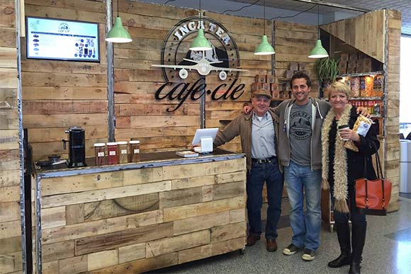 Ryan Florio with his parents in front of Inca Tea shop at the airport