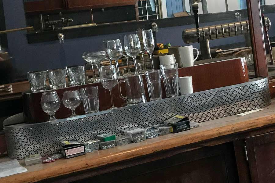 Metal detail work Jeff installed in the back bar area to cover up damaged and stained wood