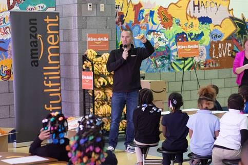 <span class="content-image-text">Amazon General Manager, Mark Huber, announces a $50,000 grant to the Cleveland Metropolitan School District</span>