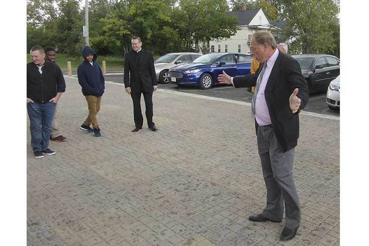 John Niedzialek showing how permeable pavers work