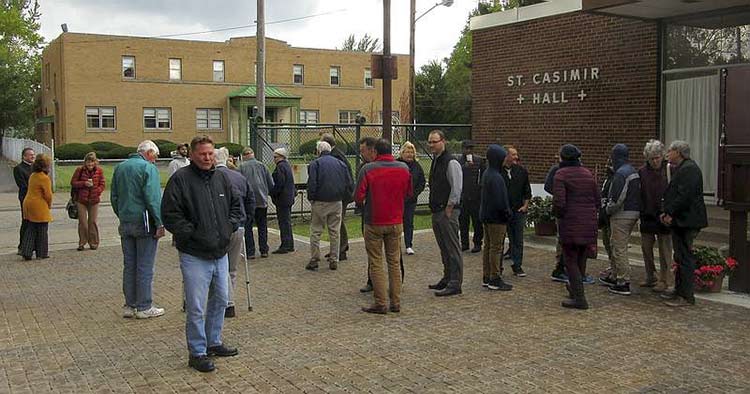 <span class="content-image-text">Workshop attendees assemble on the newly installed permeable pavers</span>