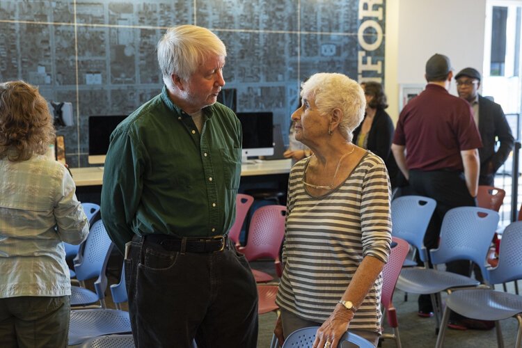 FreshWater Cleveland Managing Editor Chris Ball talks with Ride + Learn participant Nina McLellan at PNC Fairfax Connection.